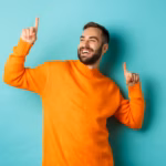 handsome-man-celebrating-feeling-winner-pointing-fingers-up-champion-dance-standing_1258-43741